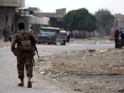 Kurdish-led forces say they have pulled out of Syria border town