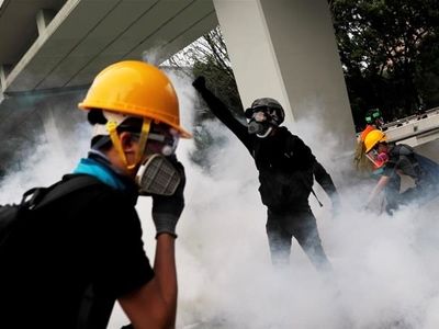 Hong Kong leader urges calm as protest tensions rise; airport reopens